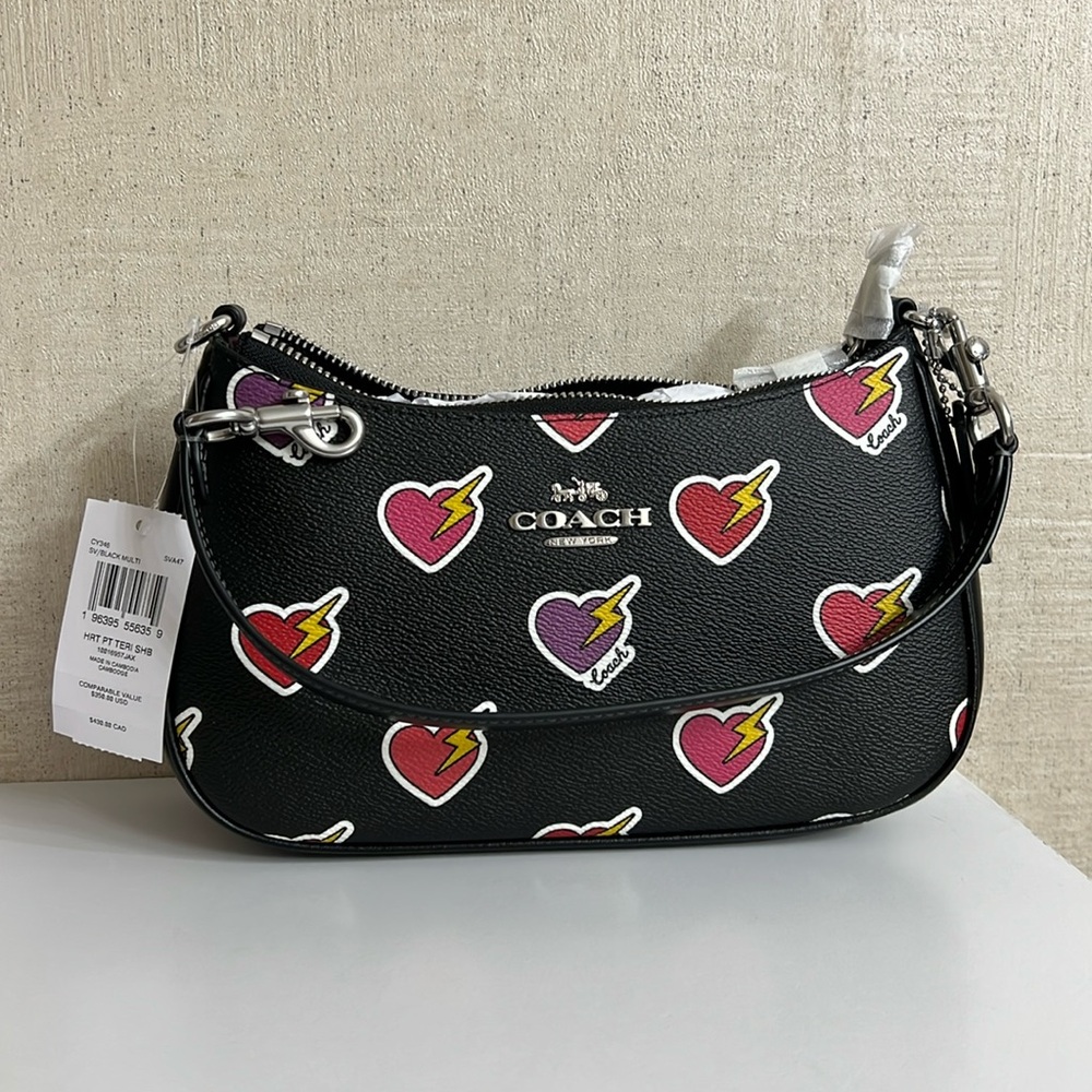Brand new Coach Terri shoulder bag with heart print